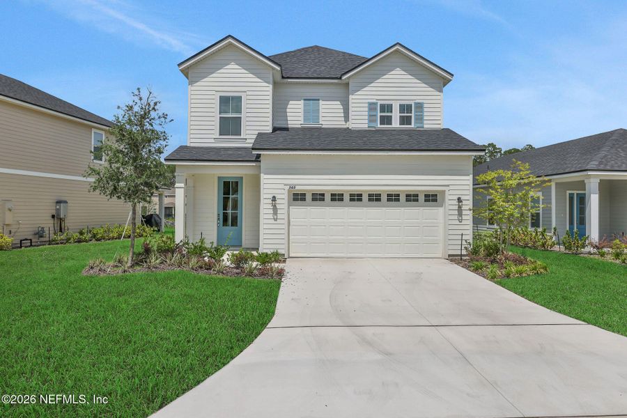 Front exterior of a new home in TrailMark, St. Augustine, FL, highlighting curb appeal (Image 29). Front exterior of a new home in TrailMark, St. Augustine, FL, highlighting curb appeal (Image 29).