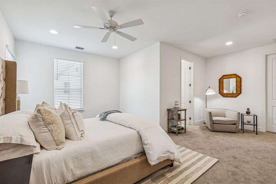 Bedroom featuring light colored carpet, recessed lighting, and a ceiling fan