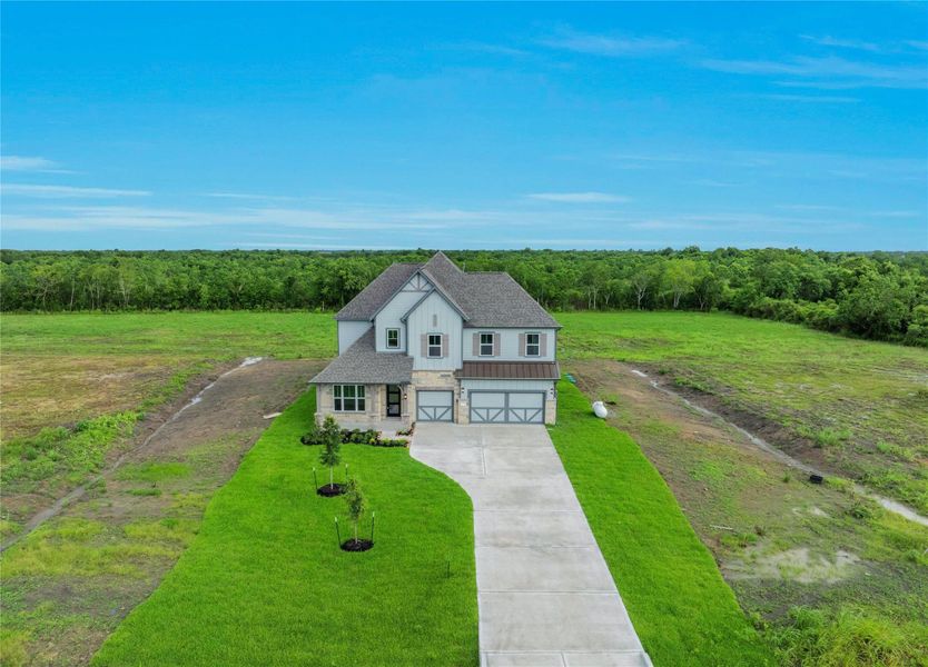 Front exterior of a new home in , Rosharon, TX, highlighting curb appeal (Image 28). Front exterior of a new home in , Rosharon, TX, highlighting curb appeal (Image 28).