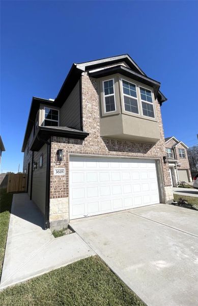 Front exterior of a new home in , Missouri City, TX, highlighting curb appeal (Image 2). Front exterior of a new home in , Missouri City, TX, highlighting curb appeal (Image 2).