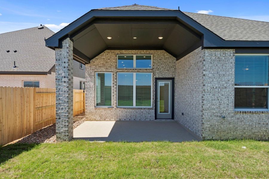Exterior details and patio area of a home in Wildrye 45', Waller (Image 19).