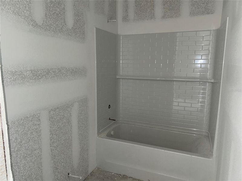 In-progress construction of a new home in Oakfield Trails Signature, Parrish, FL (Image 6).