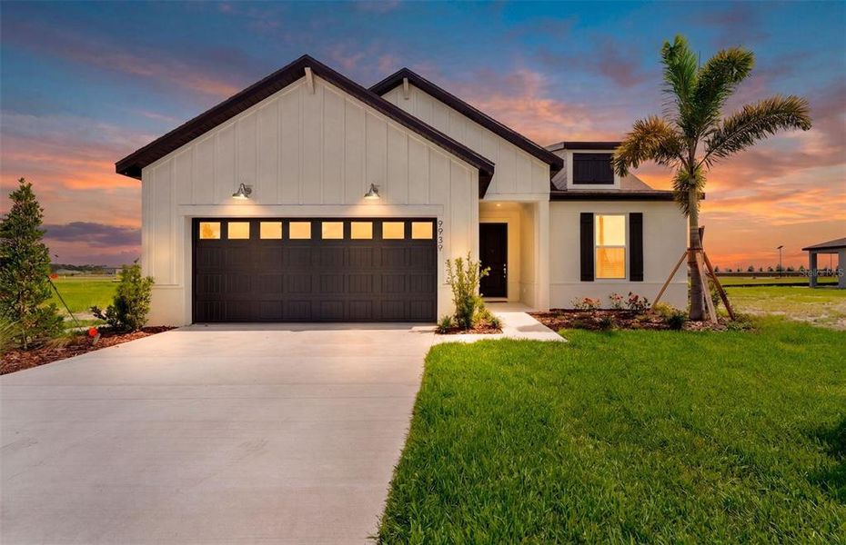 Front exterior of a new home in Seaire, Parrish, FL, highlighting curb appeal (Image 1). Front exterior of a new home in Seaire, Parrish, FL, highlighting curb appeal (Image 1).