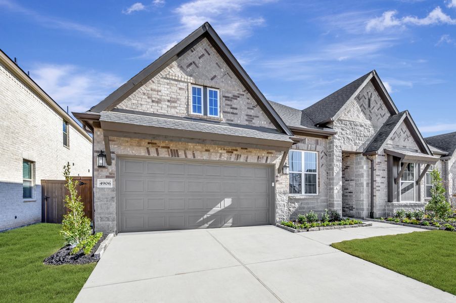 Front exterior of a new home in Brookewater - Ascent Collection, Rosenberg, TX, highlighting curb appeal (Image 2). Front exterior of a new home in Brookewater - Ascent Collection, Rosenberg, TX, highlighting curb appeal (Image 2).