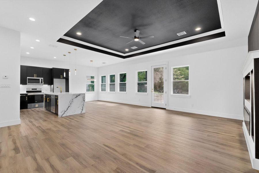 An open concept living area showcasing seamless flow between the kitchen and gathering spaces.