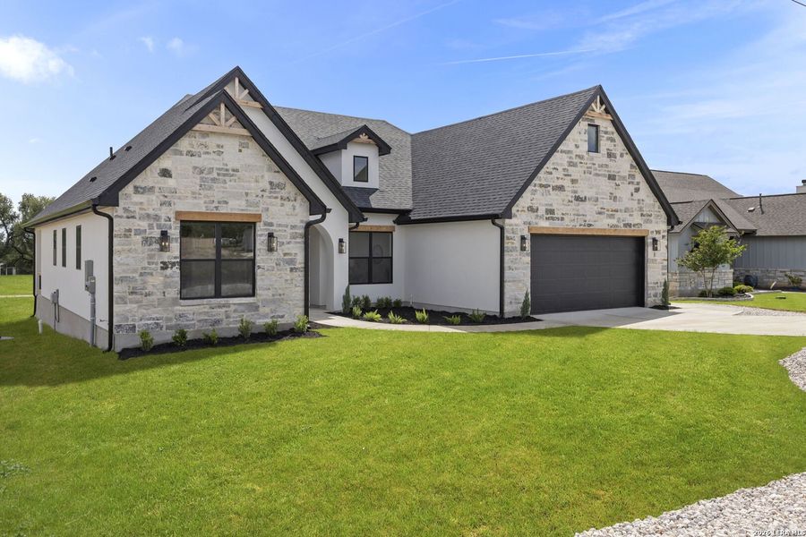 Front exterior of a new home in , Blanco, TX, highlighting curb appeal (Image 2). Front exterior of a new home in , Blanco, TX, highlighting curb appeal (Image 2).