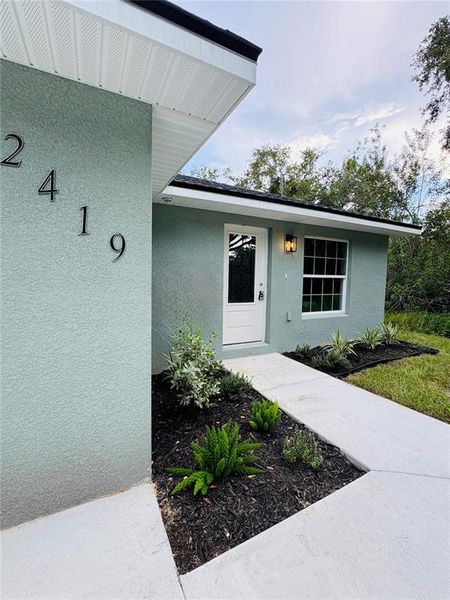 Front exterior of a new home in , Lakeland, FL, highlighting curb appeal (Image 17).