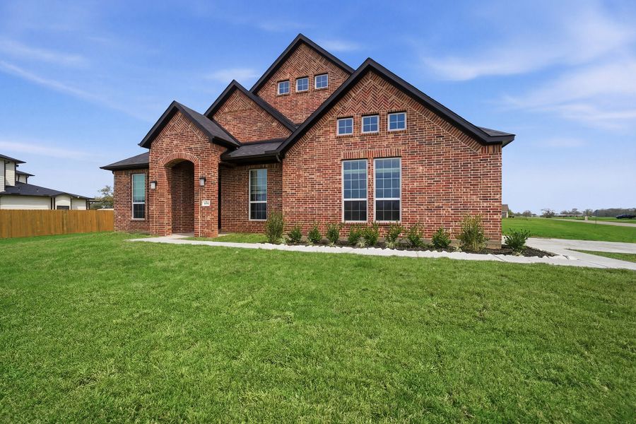 Front exterior of a new home in Suncreek Estates, Rosharon, TX, highlighting curb appeal (Image 25). Front exterior of a new home in Suncreek Estates, Rosharon, TX, highlighting curb appeal (Image 25).