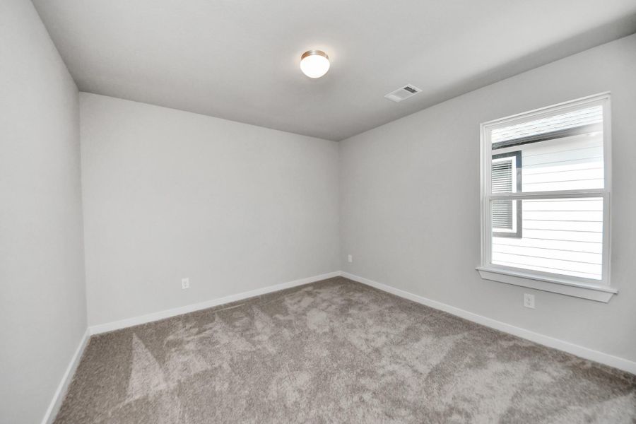 Generously sized secondary bedrooms featuring spacious closets, soft and inviting carpeting underfoot, large windows allowing plenty of natural light, and the added touch of privacy blinds for your personal retreat. Generously sized secondary bedrooms featuring spacious closets, soft and inviting carpeting underfoot, large windows allowing plenty of natural light, and the added touch of privacy blinds for your personal retreat.