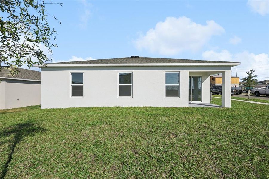 Exterior details and patio area of a home in The Enclave at Scenic Terrace, Haines City (Image 7).