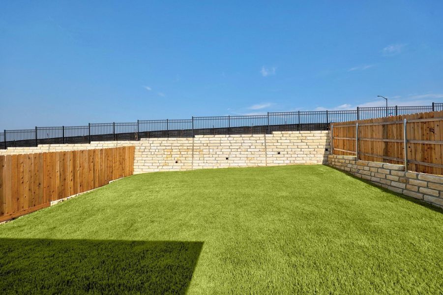 Exterior details and patio area of a home in Lakeside at Tessera, Lago Vista (Image 22).
