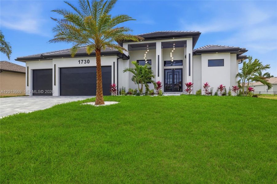 Front exterior of a new home in , Cape Coral, FL, highlighting curb appeal (Image 26).