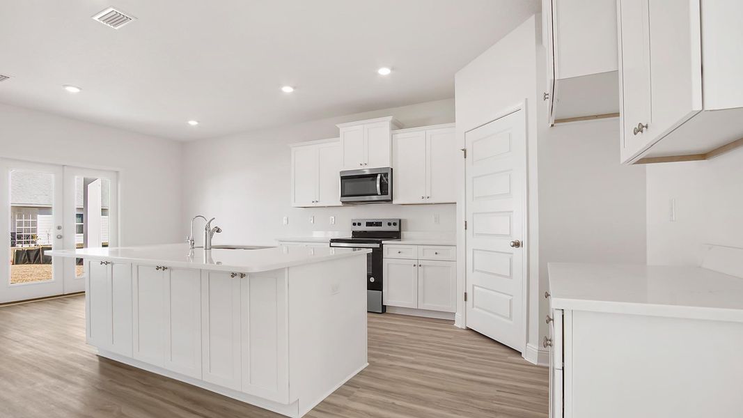 Furnished interior view inside a new home in Bayside at Ward Creek, Panama City Beach (Image 3).