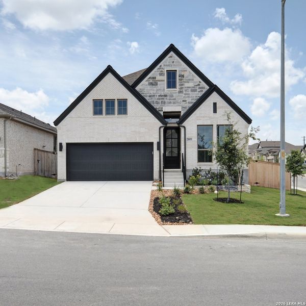 Front exterior of a new home in Ladera, San Antonio, TX, highlighting curb appeal (Image 22). Front exterior of a new home in Ladera, San Antonio, TX, highlighting curb appeal (Image 22).