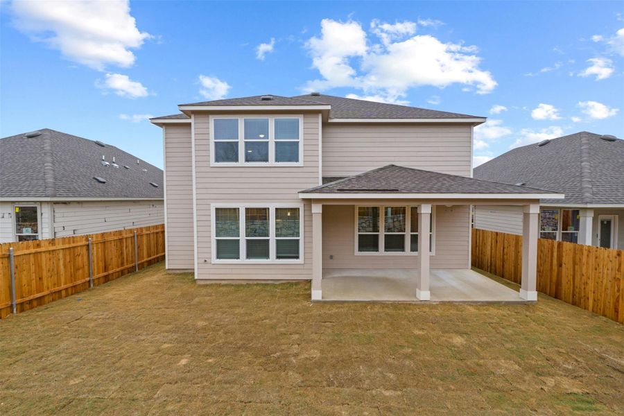 Front exterior of a new home in McKinney Crossing, Austin, TX, highlighting curb appeal (Image 21). Front exterior of a new home in McKinney Crossing, Austin, TX, highlighting curb appeal (Image 21).