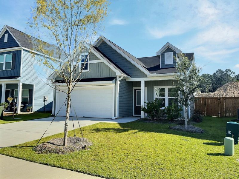 Front exterior of a new home in Six Oaks, Summerville, SC, highlighting curb appeal (Image 14).