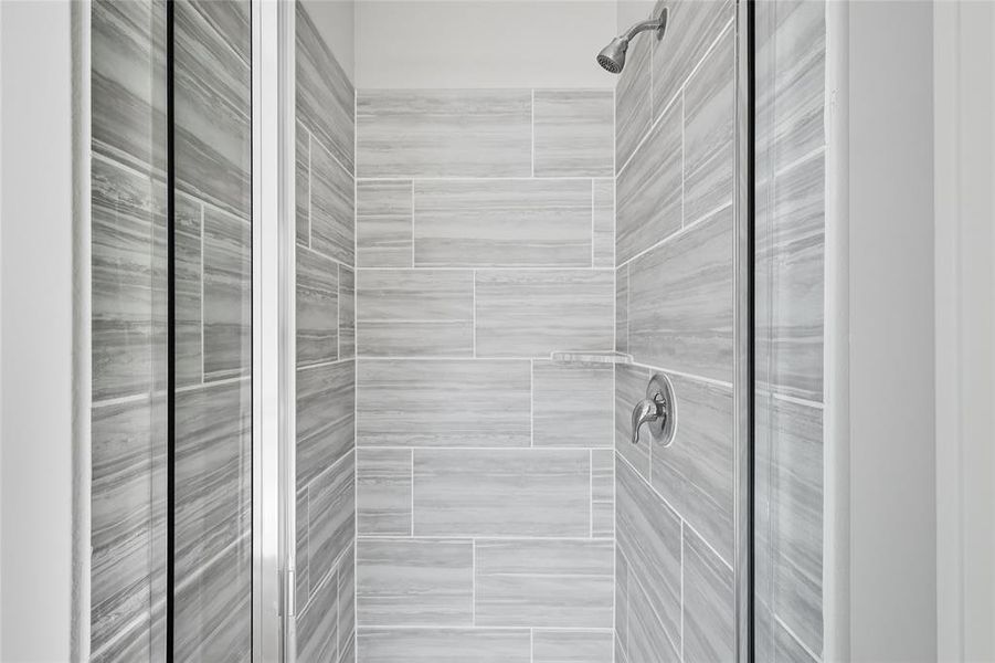 Bathroom featuring a shower stall Bathroom featuring a shower stall