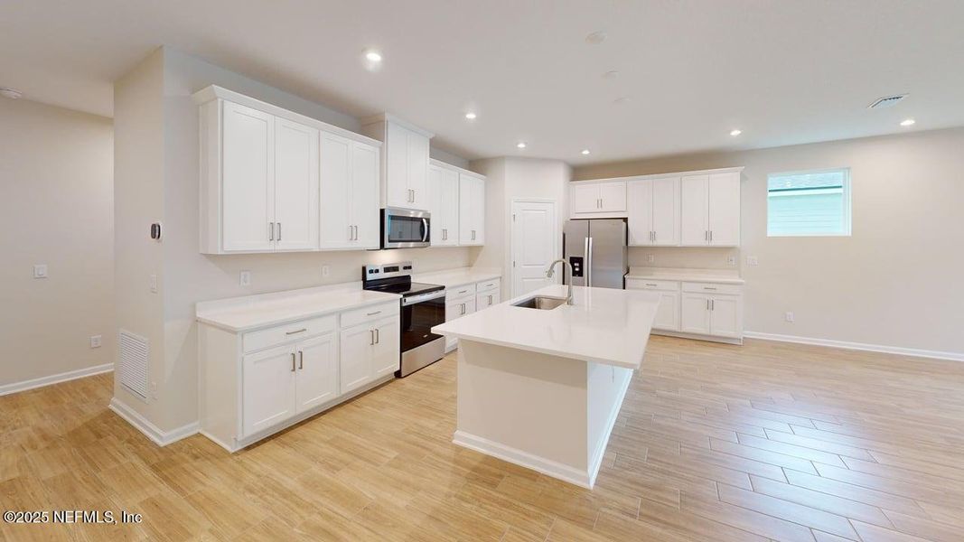 Furnished interior view inside a new home in Lakes at Bella Lago, Green Cove Springs (Image 4). Furnished interior view inside a new home in Lakes at Bella Lago, Green Cove Springs (Image 4).
