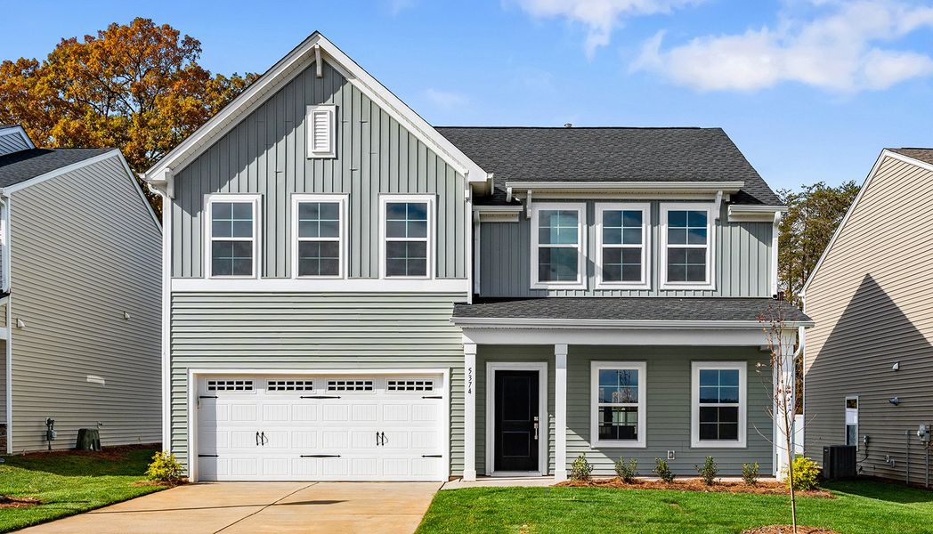 Front exterior of a new home in Hanes Lake, Winston-Salem, NC, highlighting curb appeal (Image 1). Front exterior of a new home in Hanes Lake, Winston-Salem, NC, highlighting curb appeal (Image 1).