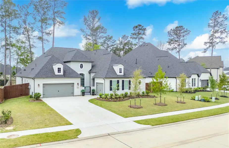 Front exterior of a new home in , Conroe, TX, highlighting curb appeal (Image 1). Front exterior of a new home in , Conroe, TX, highlighting curb appeal (Image 1).