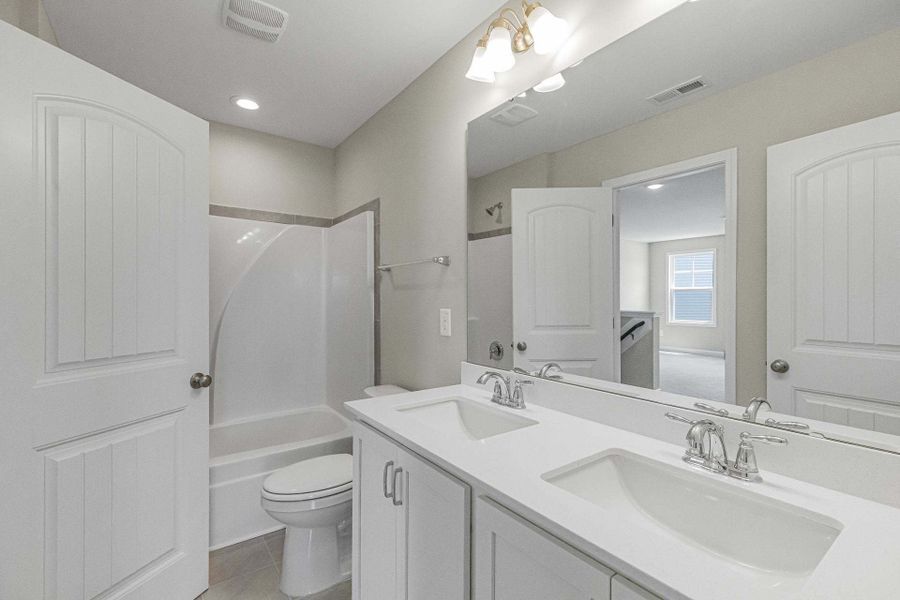 Representative furnished interior of a home built from the Magnolia by Caviness & Cates Communities in Bartlett Manor, Youngsville (Image 194).