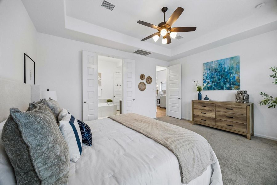 This is the perfect space to begin and end your day with soft neutral finishes, ample room to stretch out and relax, a massive walk-in closet, and a spa-like ensuite designed for everyday comfort.