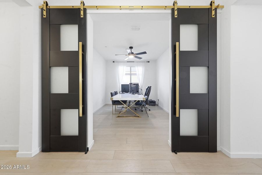 Office with barn doors for added privacy