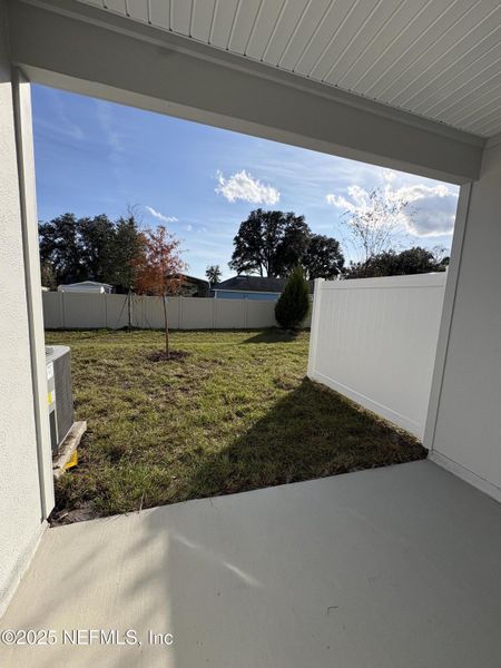 Exterior details and patio area of a home in Cordera Townhomes, St. Augustine (Image 20).
