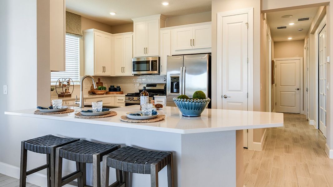 Furnished interior view inside a new home in Esplanade at Kingston, Estero (Image 5).