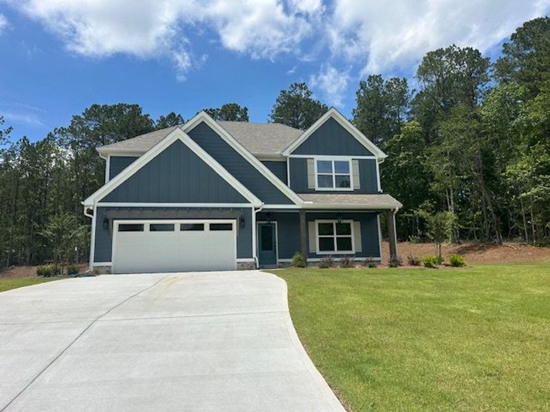 Front exterior of a new home in Sagebrook, Newnan, GA, highlighting curb appeal (Image 1).