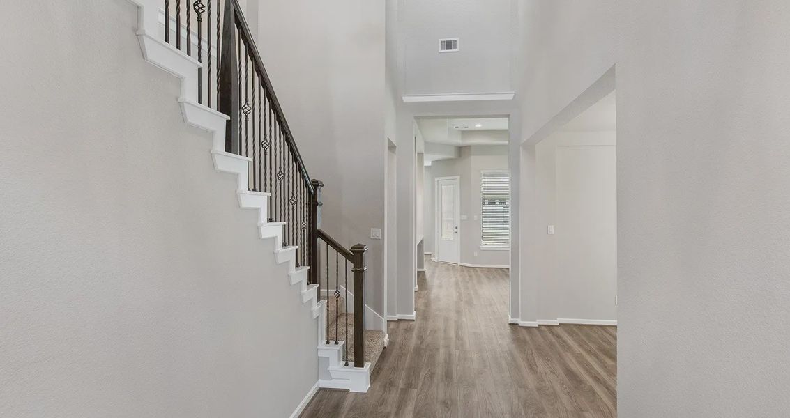 Representative unfurnished interior of a home built from the Pendleton by Chesmar Homes in The Woodlands Hills, Willis (Image 8).