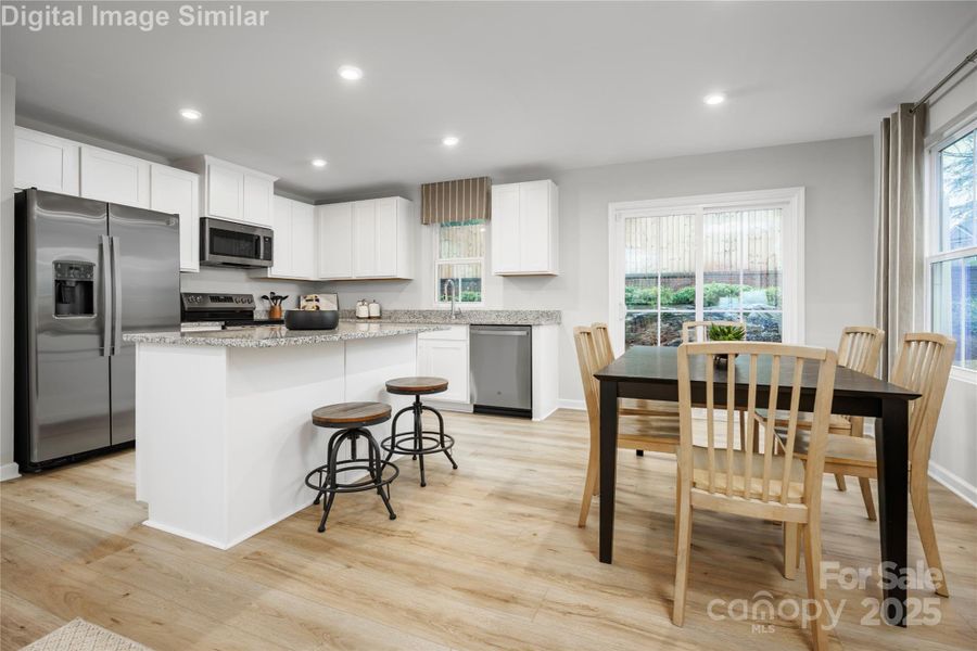Enjoy the Large Kitchen Island and adjacent Dining Area-Perfect for Entertaining!