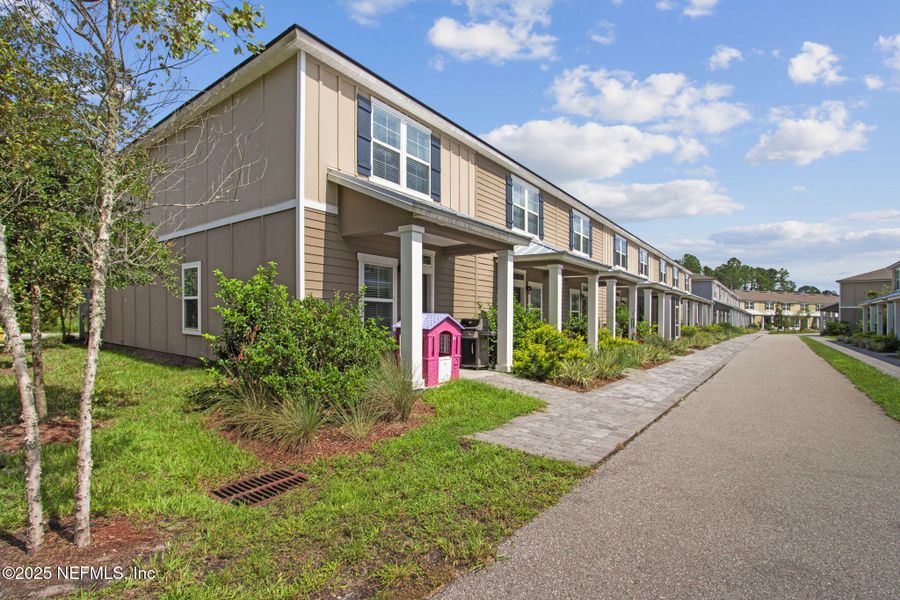 Front exterior of a new home in , Yulee, FL, highlighting curb appeal (Image 21).