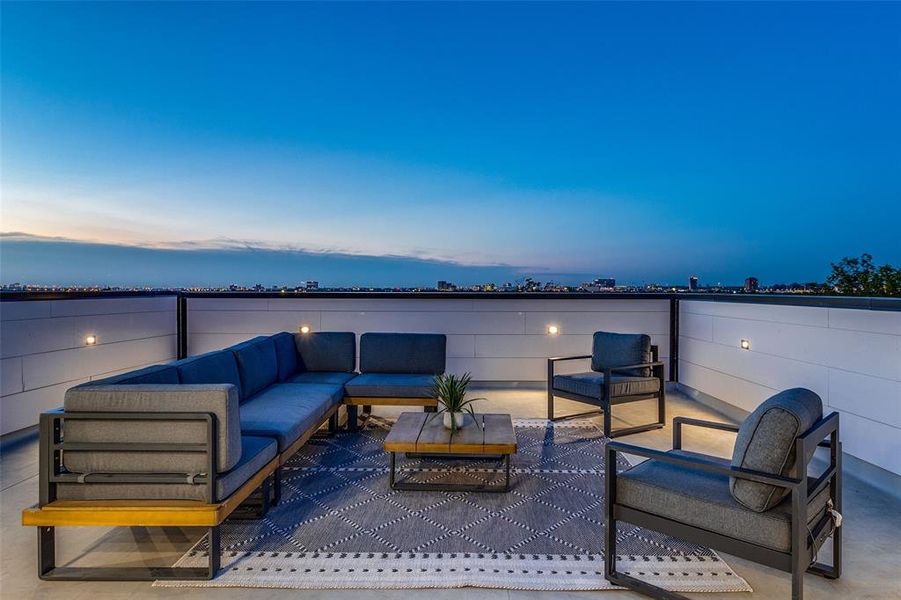 Patio terrace at dusk with an outdoor living space