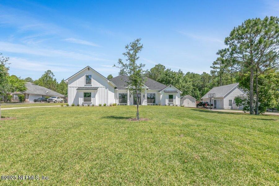 Front exterior of a new home in , Jacksonville, FL, highlighting curb appeal (Image 29).