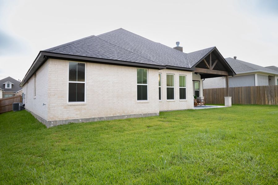 Front exterior of a new home in Greenbrier, Bryan, TX, highlighting curb appeal (Image 24).