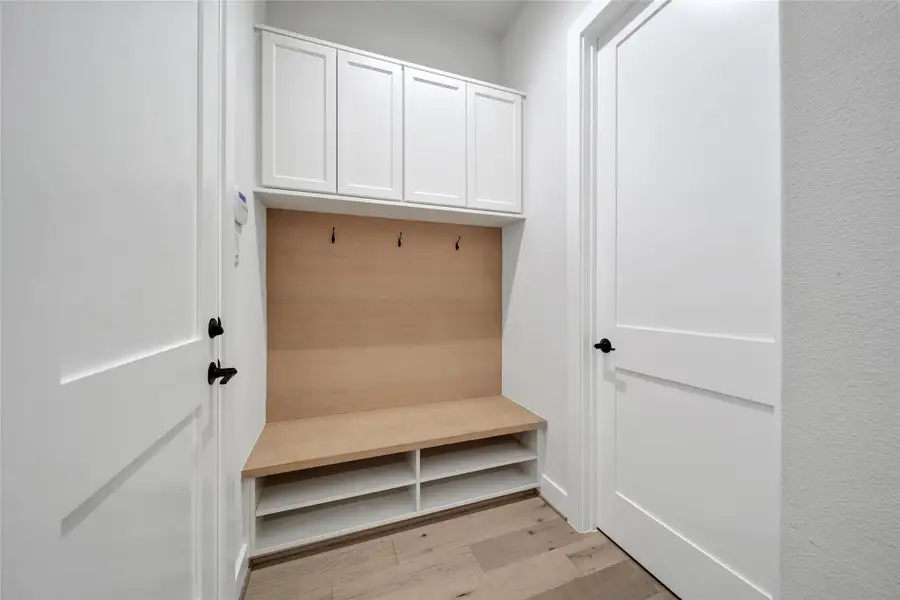Furnished interior view inside a new home in ARTAVIA, Conroe (Image 12).