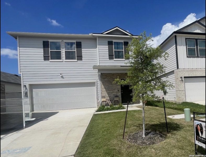 Front exterior of a new home in Park Place, New Braunfels, TX, highlighting curb appeal (Image 2). Front exterior of a new home in Park Place, New Braunfels, TX, highlighting curb appeal (Image 2).