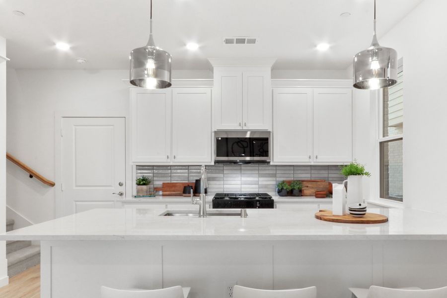 Representative furnished interior of a home built from the Coral (FE) by Grenadier Homes in Wildridge, Oak Point (Image 4).