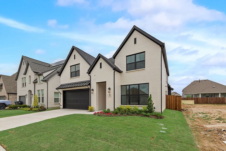 Front exterior of a new home in Tavolo Park, Fort Worth, TX, highlighting curb appeal (Image 2). Front exterior of a new home in Tavolo Park, Fort Worth, TX, highlighting curb appeal (Image 2).