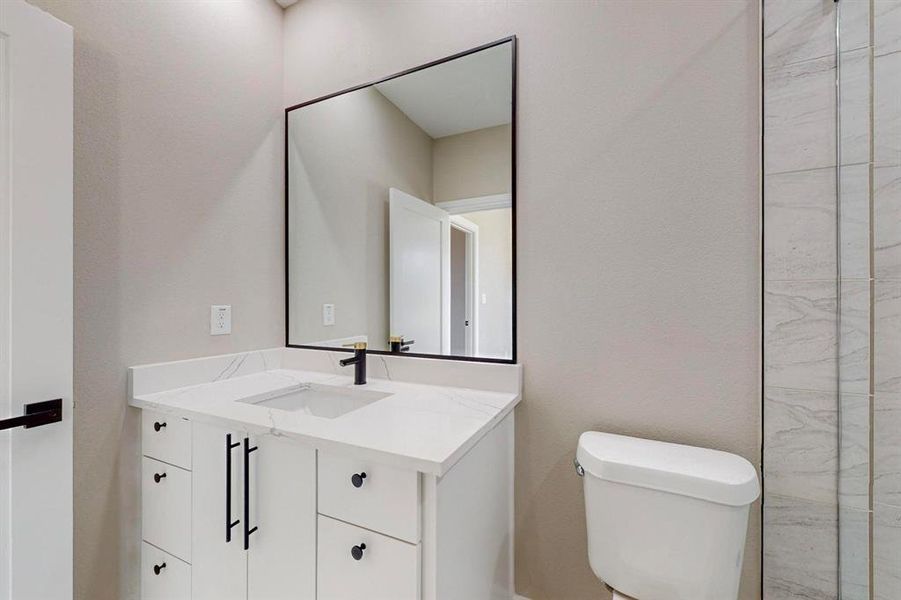 Bathroom with vanity and toilet