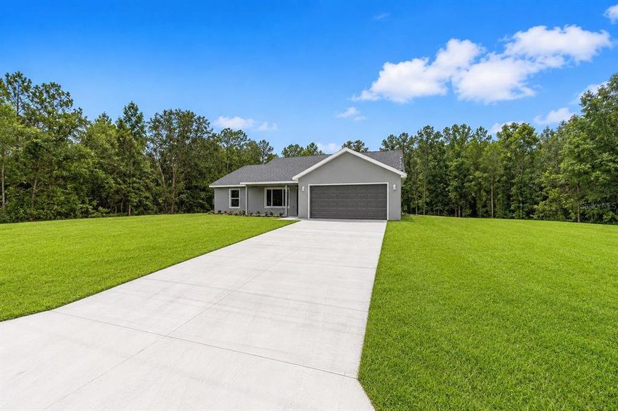 Front exterior of a new home in , Dunnellon, FL, highlighting curb appeal (Image 2). Front exterior of a new home in , Dunnellon, FL, highlighting curb appeal (Image 2).