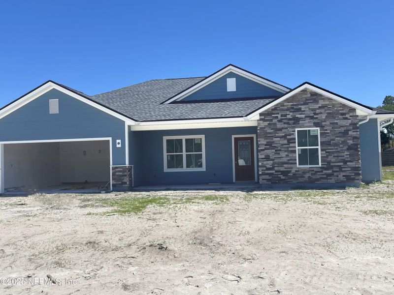 Front exterior of a new home in , Keystone Heights, FL, highlighting curb appeal (Image 11).