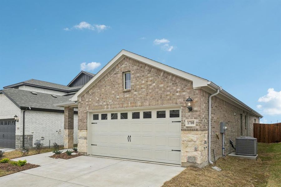 Front exterior of a new home in Parks at Foster Crossing - Spring Series, Anna, TX, highlighting curb appeal (Image 1). Front exterior of a new home in Parks at Foster Crossing - Spring Series, Anna, TX, highlighting curb appeal (Image 1).