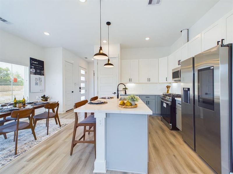 MOVE-IN READY! High-end interior finishes including quartz countertops, big kitchen island, stainless-steel appliances, upgraded cabinets with soft close drawers. FINISHES & FLOOR PLANS WILL VARY! Ceiling fans are not included!