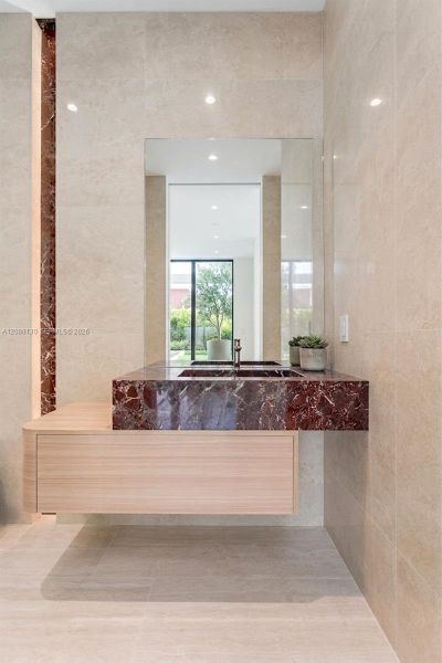 Guest Bathroom. Disclaimer: Several photographs presented in this listing contain digitally added furniture, artwork, and decor. These virtually staged images are intended solely for illustrative purposes.