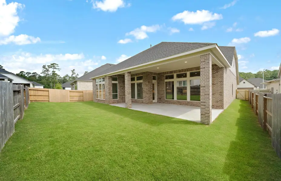 Exterior details and patio area of a home in Audubon 60', Magnolia (Image 3).