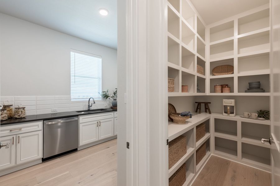 Representative furnished interior of a home built from the Woodbridge by Tri Pointe Homes in Bridgeland, Cypress (Image 17).