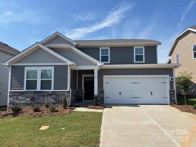 Front exterior of a new home in Blue Sky Meadows, Monroe, NC, highlighting curb appeal (Image 1).