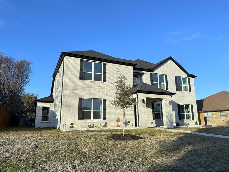 View of front of property with a front lawn